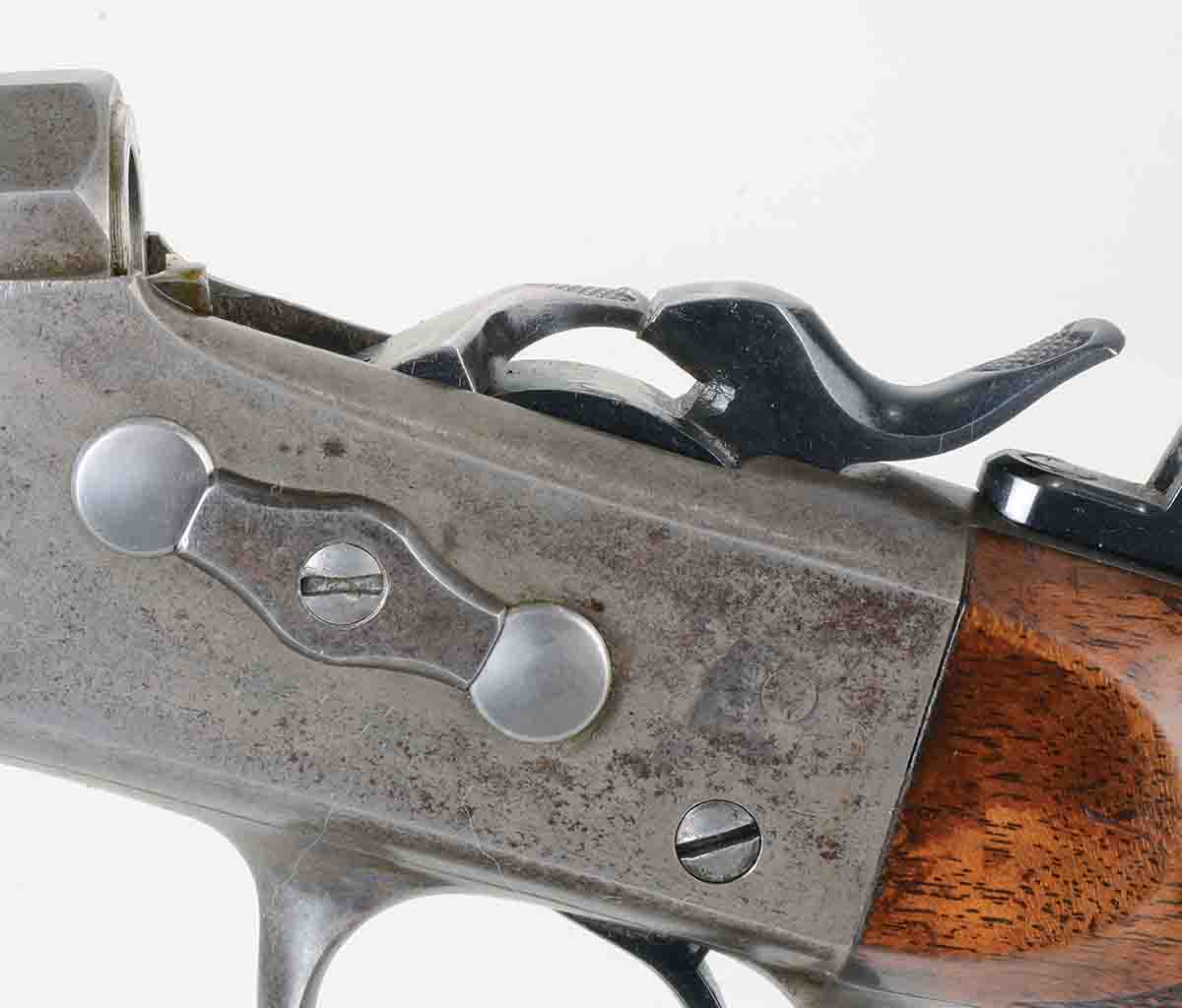 Remington No. 1 rolling blocks were limited to a case length of about 21⁄4 inches, because case rims would interfere with the hammer nose in chambering. Note the two hardened pins on which rolling block hammers and breechblocks pivoted.